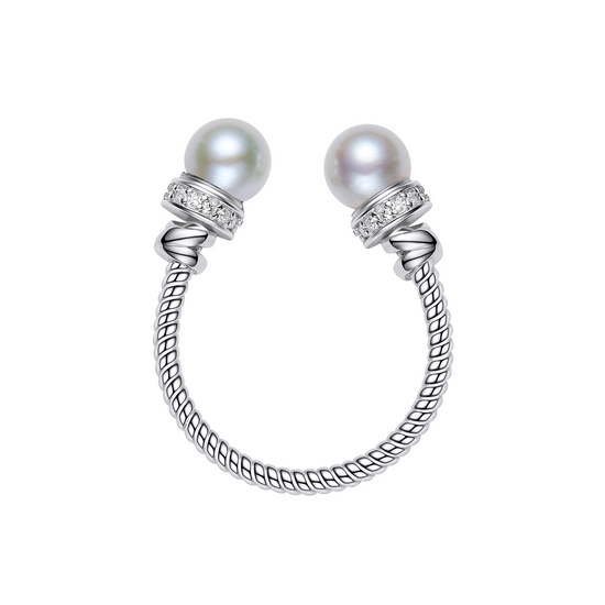 Pair of pearl earrings with silver and diamond accents on a white background