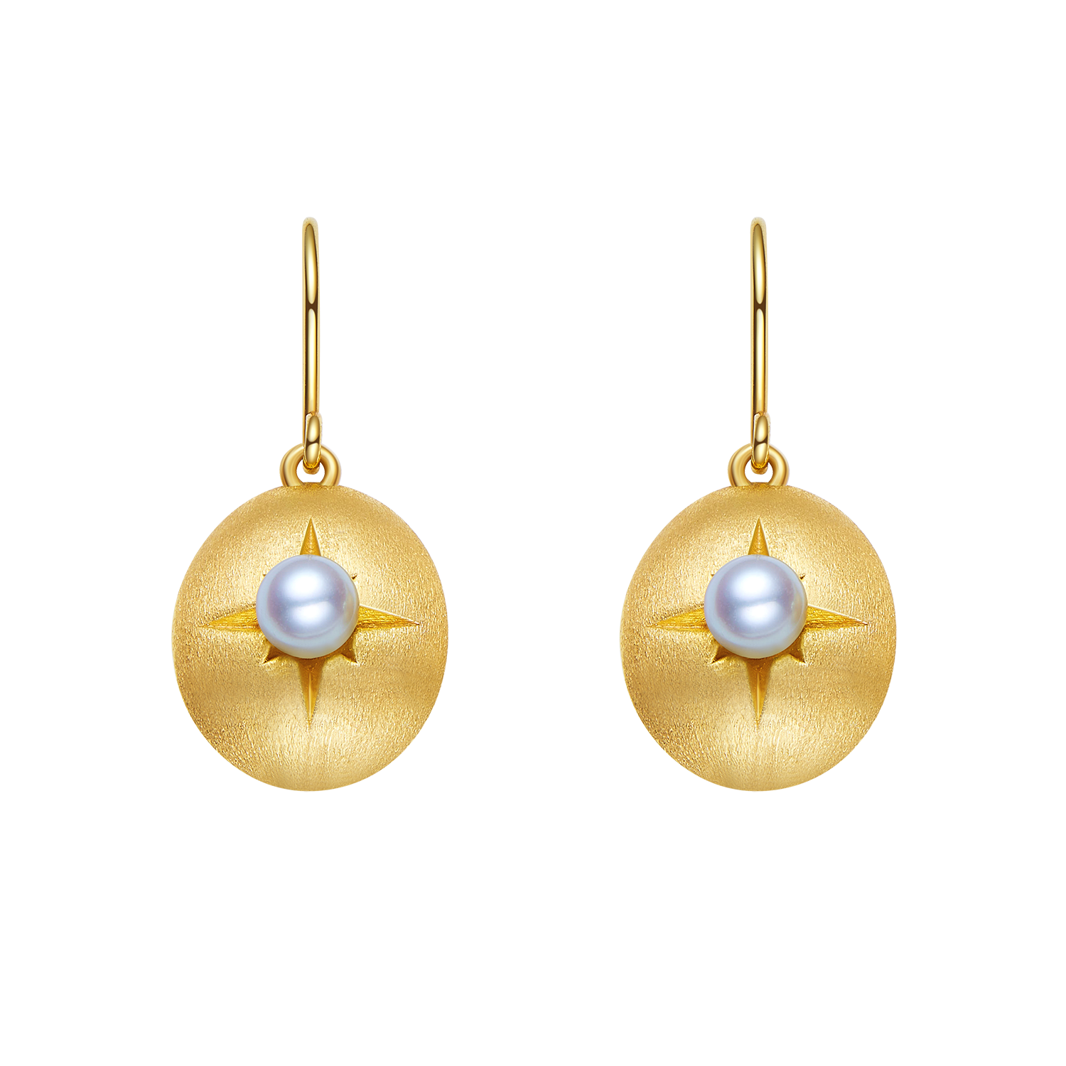 Gold earrings with pearl center on a white background
