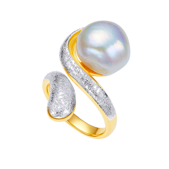 Gold and silver ring with a pearl on a white background