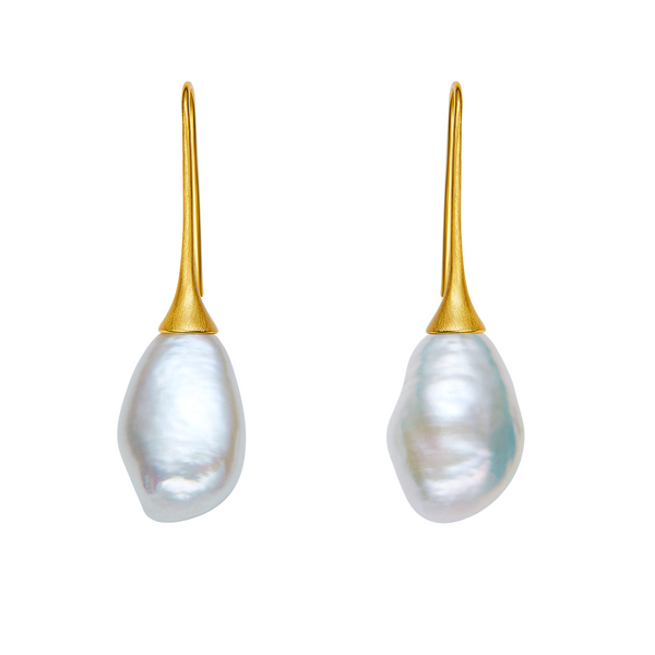 Pearl earrings with gold hooks on a white background
