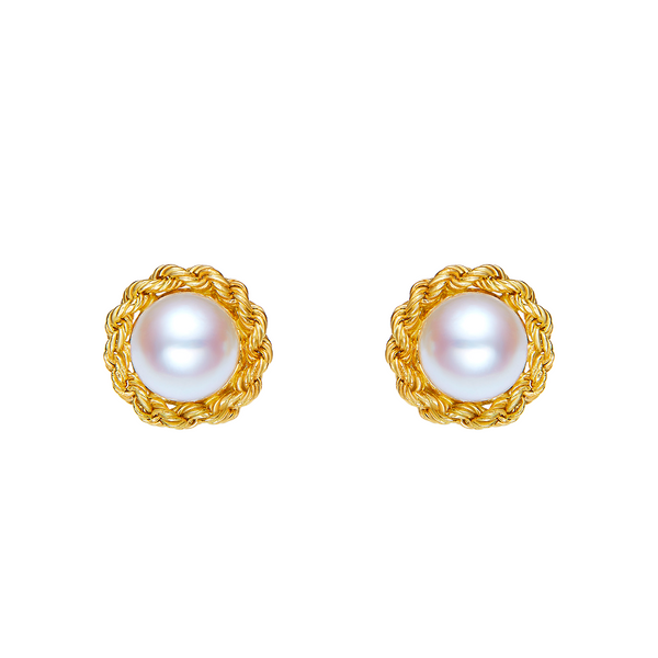 Pair of pearl earrings with gold frames on a white background