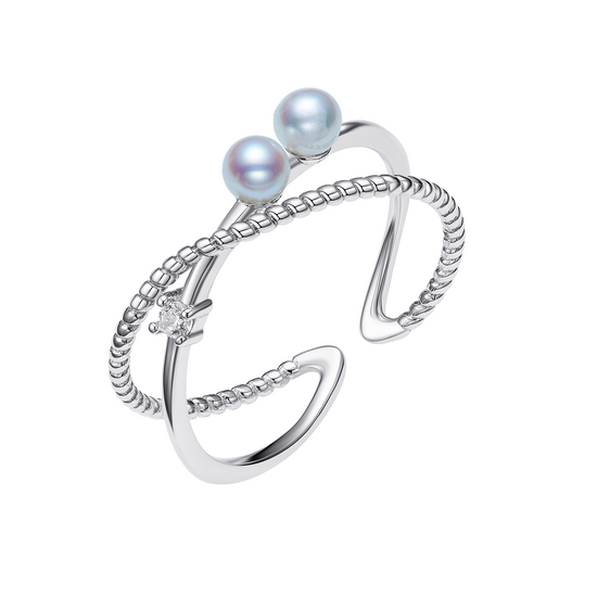 Silver ring with two pearls on a white background