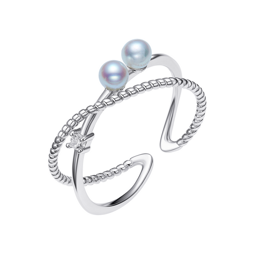 Silver ring with two pearls on a white background