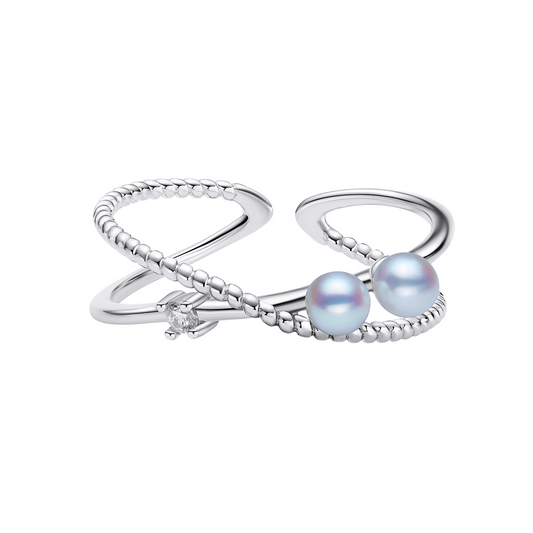 Silver ring with two pearls on a white background