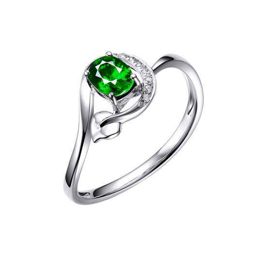 Silver ring with a green gemstone on a white background