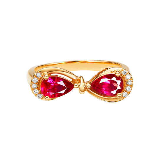 Gold ring with red gemstones and small diamonds on a white background