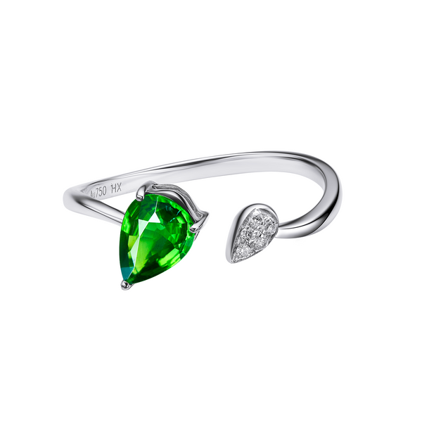 Silver ring with a green teardrop-shaped gemstone on a white background