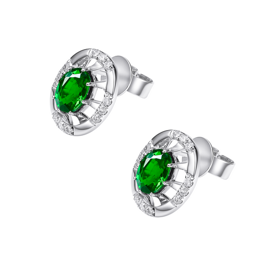 Silver earrings with green gemstones on a white background