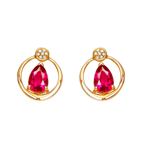 Gold earrings with red gemstones on a white background