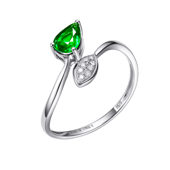 Silver ring with green gemstone and diamond accents on a white background