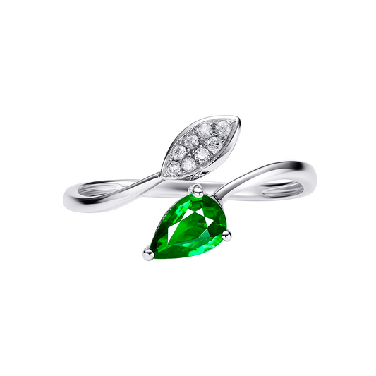 Silver ring with green gemstone and diamond accents on a white background