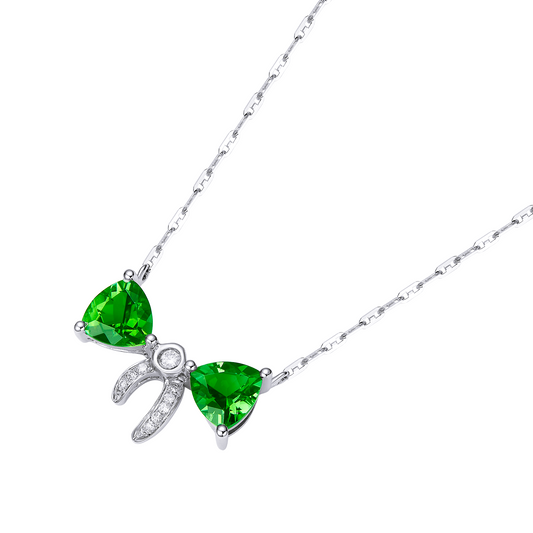 Necklace with green gemstones and silver clasp on a white background