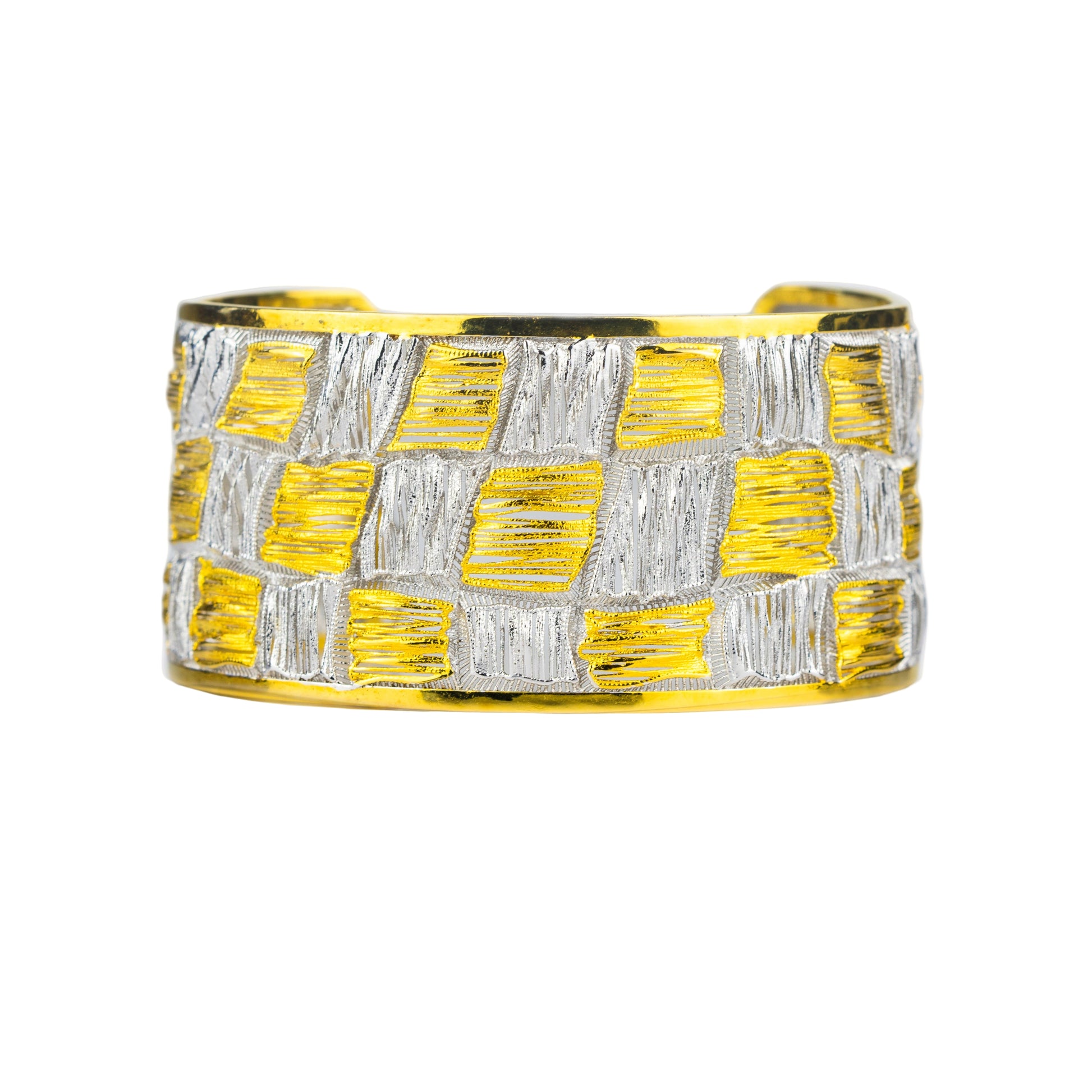 Yellow and silver woven cuff bracelet on a light gray background
