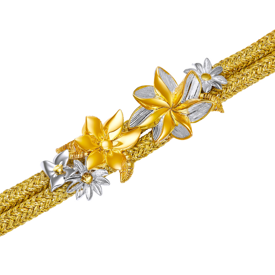 Gold and silver floral bracelet on a white background