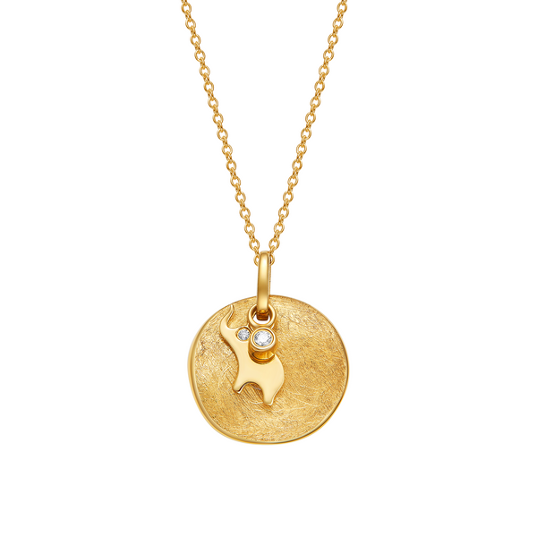 Gold necklace with a round pendant and small heart-shaped charm on a white background