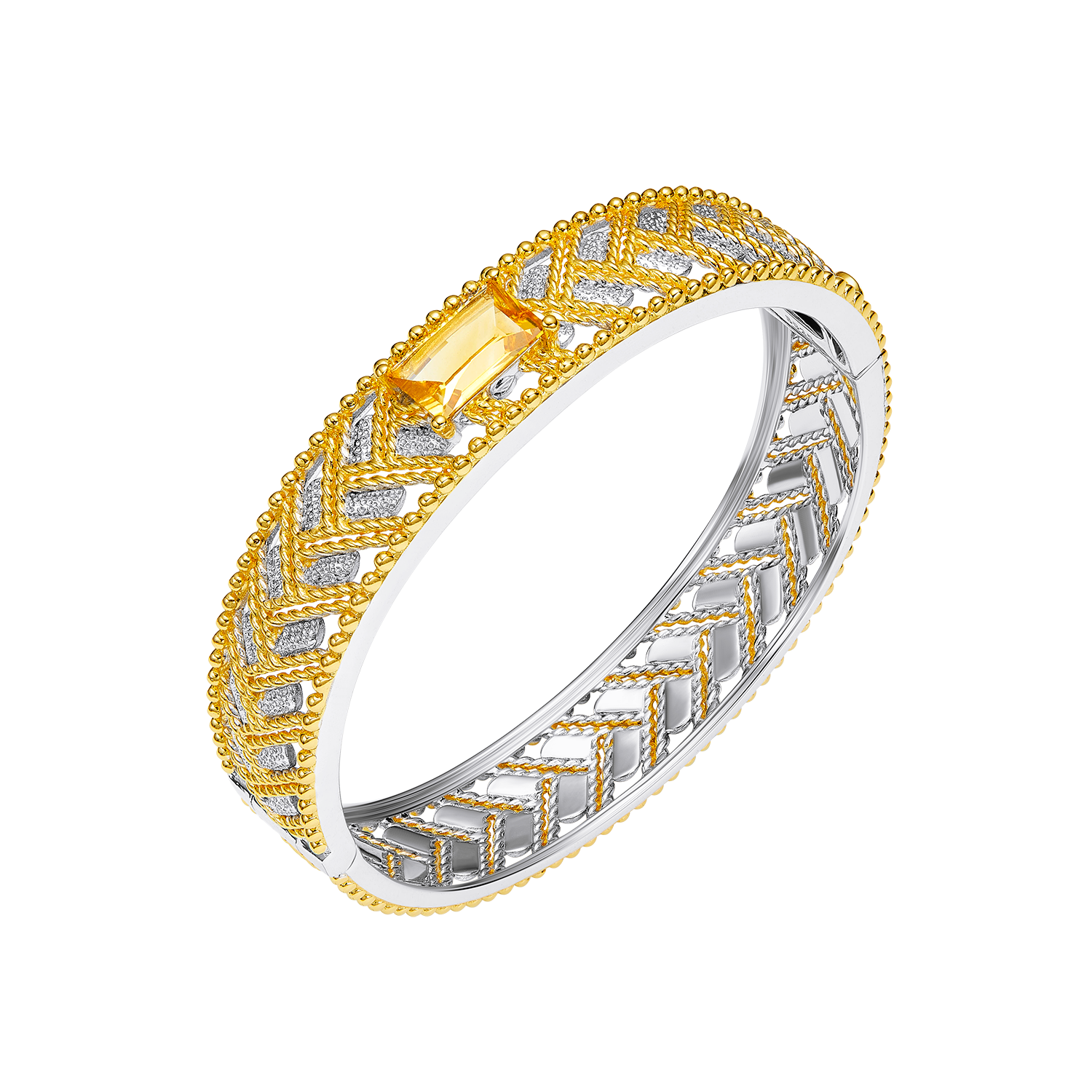 Gold and silver ring with intricate design on a white background