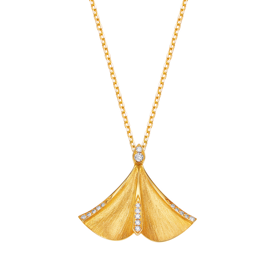 Gold necklace with a fan-shaped pendant on a white background