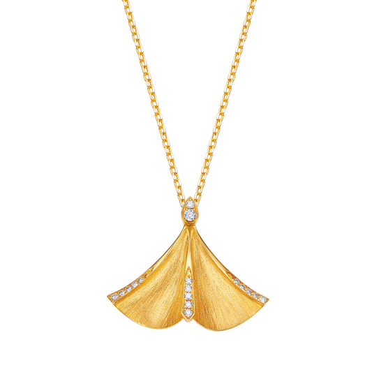 Gold necklace with a fan-shaped pendant on a white background