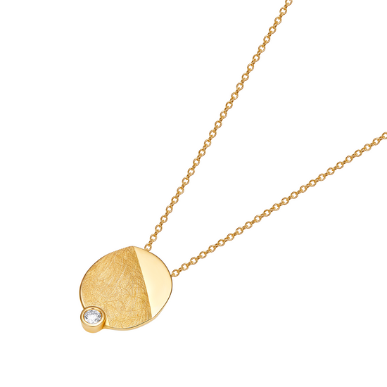 Gold necklace with a round pendant on a white background