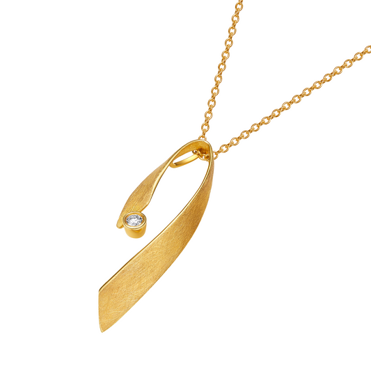 Gold necklace with a unique pendant on a white background