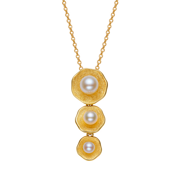 Gold necklace with three pearl pendants on a white background