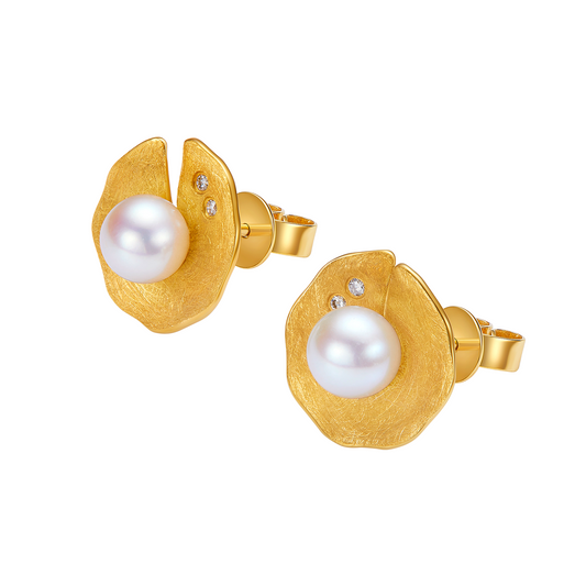 Gold earrings with pearls on a white background