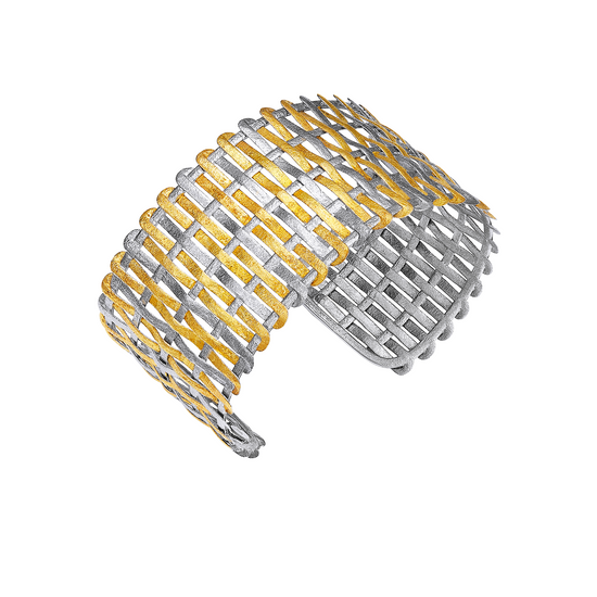 Two woven metal bracelets, one gold and one silver, on a white background.